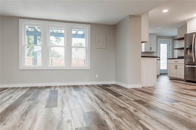 unfurnished living room with light hardwood / wood-style flooring