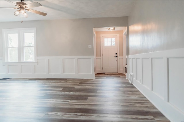 entryway with dark hardwood / wood-style flooring and ceiling fan