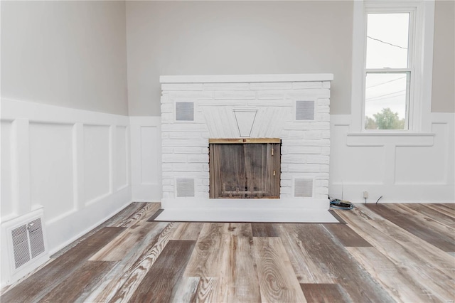 unfurnished living room featuring hardwood / wood-style floors