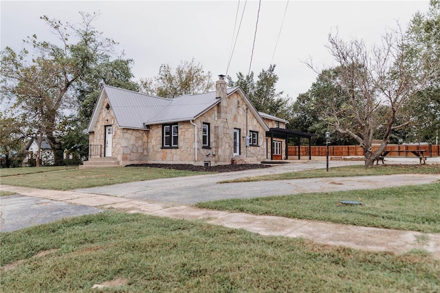 view of side of home with a lawn