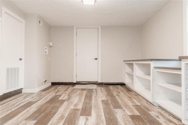 spare room with light wood-type flooring