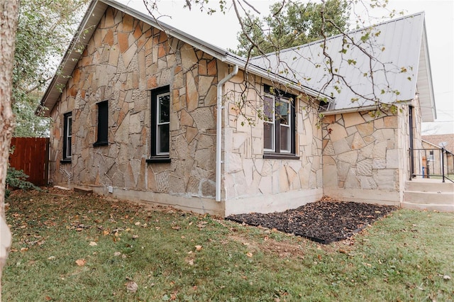 view of home's exterior featuring a lawn