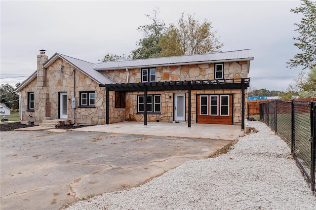 view of front facade with a patio area