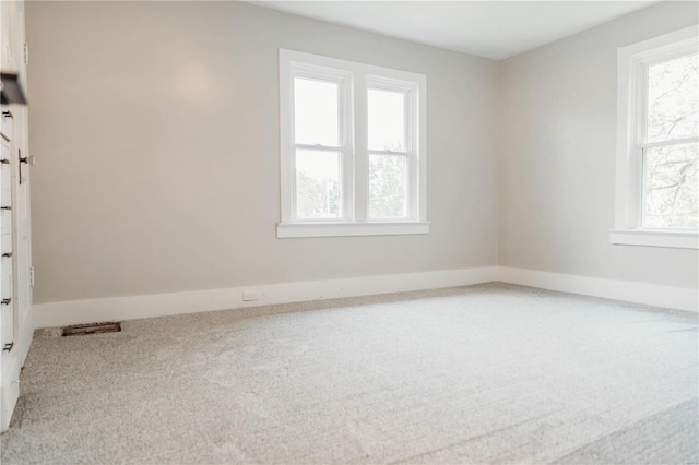 empty room featuring carpet floors