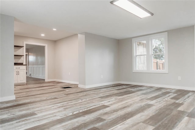 unfurnished living room featuring light hardwood / wood-style floors