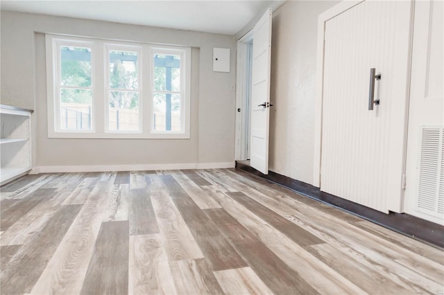 unfurnished bedroom featuring light hardwood / wood-style flooring