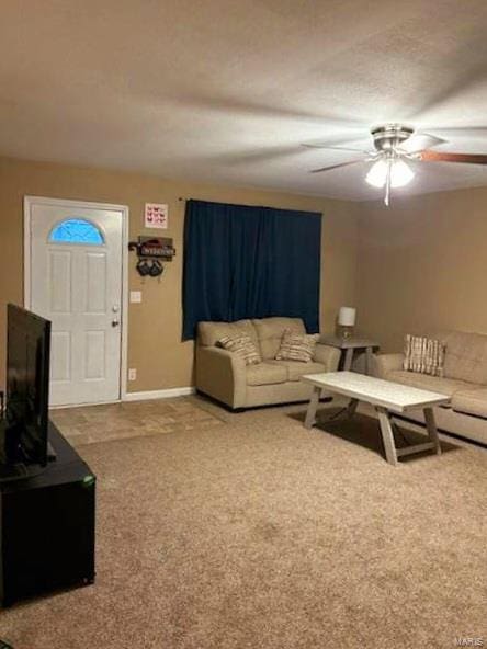 living room featuring carpet and ceiling fan