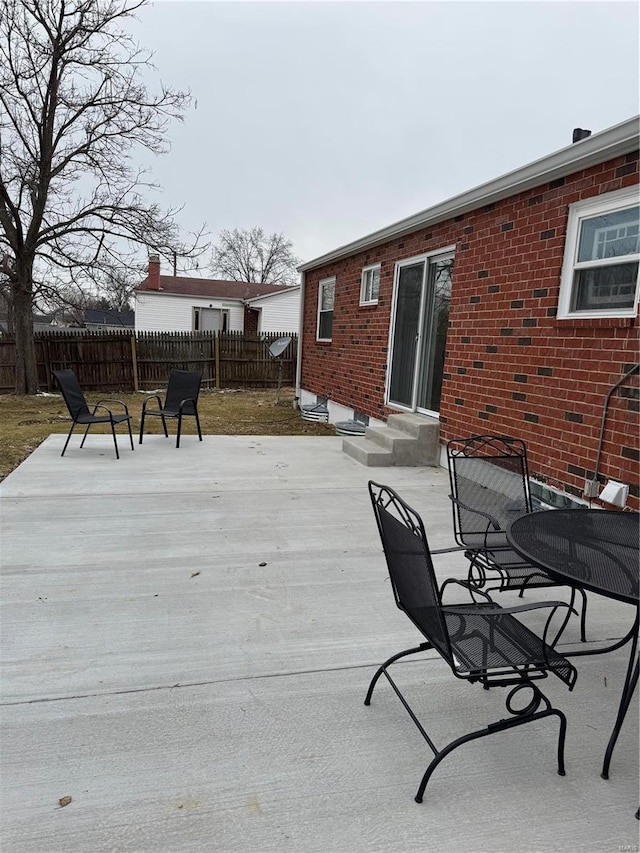 wooden terrace featuring a patio