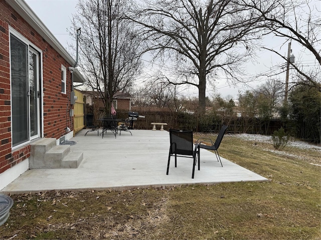 exterior space with a patio and a lawn