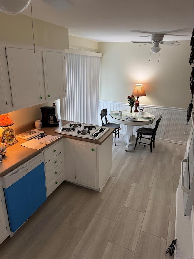 kitchen with white cabinetry, white appliances, and ceiling fan