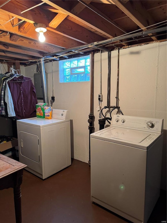 clothes washing area featuring washing machine and clothes dryer and electric panel