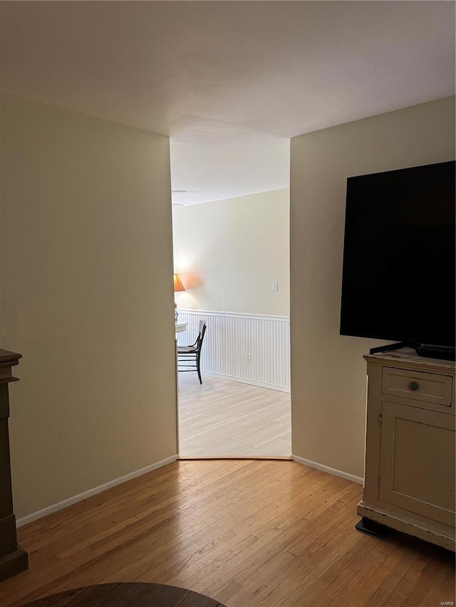 unfurnished living room with light hardwood / wood-style flooring