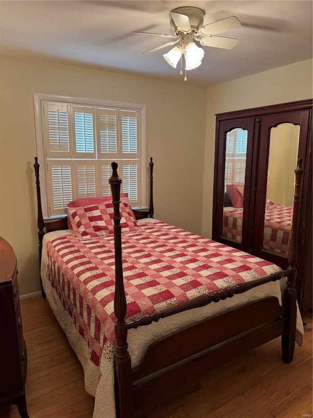 bedroom featuring ceiling fan and hardwood / wood-style floors