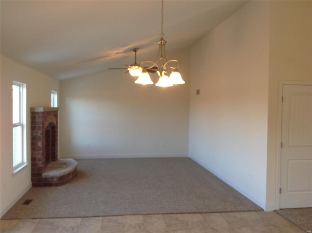 unfurnished room with an inviting chandelier, carpet floors, and vaulted ceiling