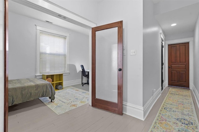 bedroom featuring light wood-type flooring