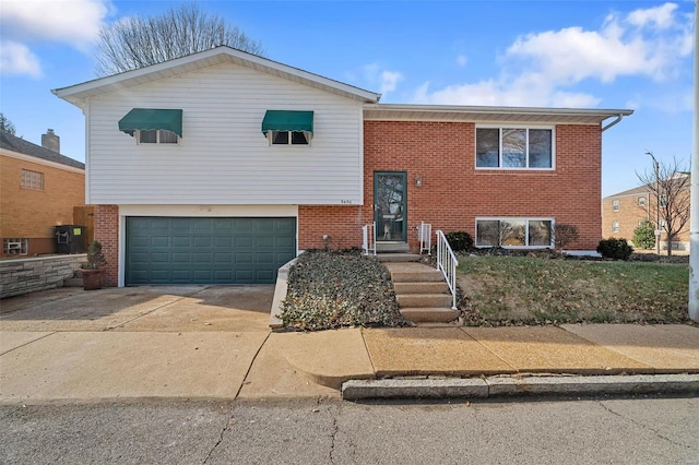 split foyer home featuring a garage