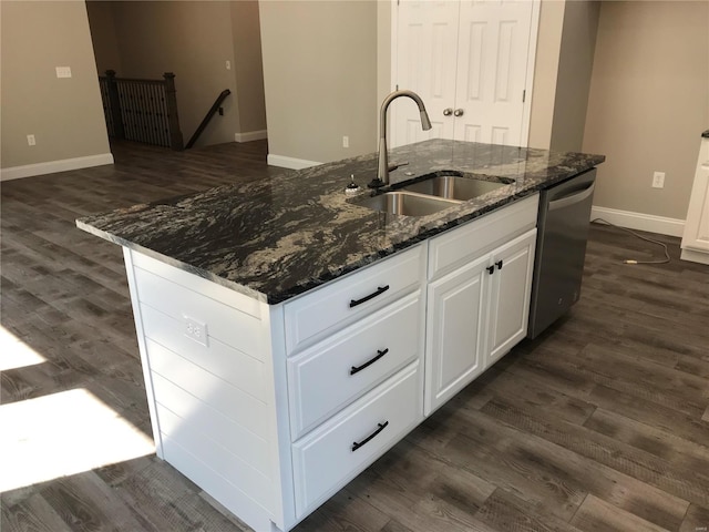 kitchen with white cabinetry, dishwasher, sink, and a center island with sink