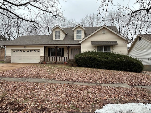 view of front facade with a garage and a porch