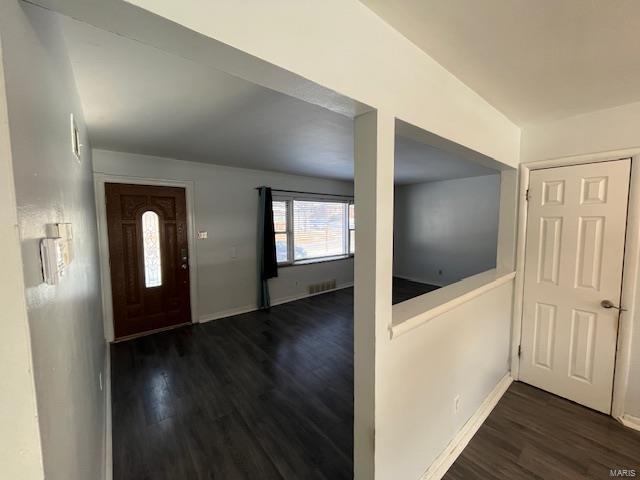 foyer entrance featuring dark hardwood / wood-style flooring