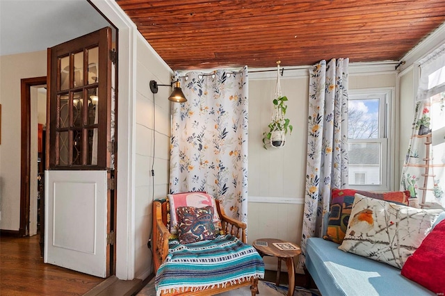 sitting room with dark hardwood / wood-style floors and wooden ceiling