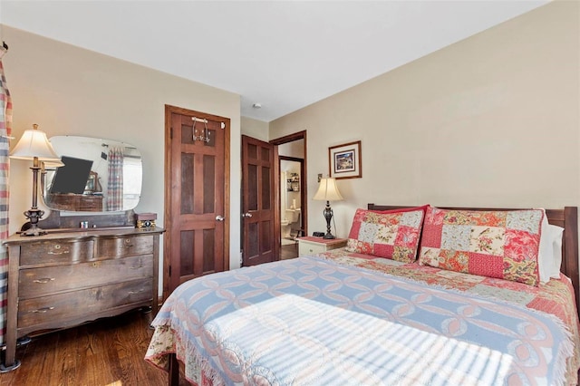 bedroom with dark wood-type flooring