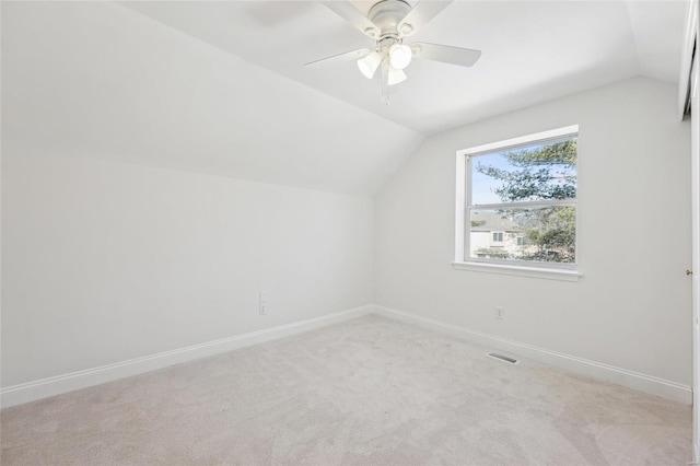 bonus room featuring light carpet, vaulted ceiling, and ceiling fan