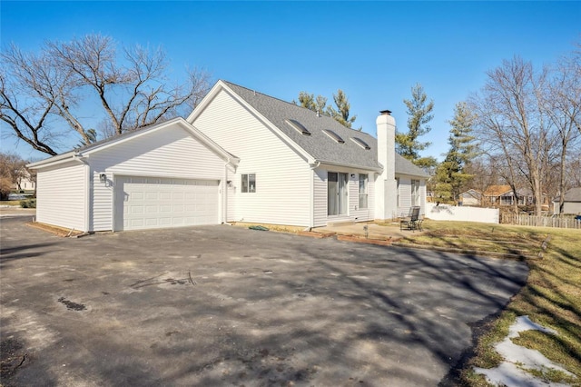 view of home's exterior with a garage