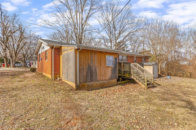 view of outbuilding with a lawn