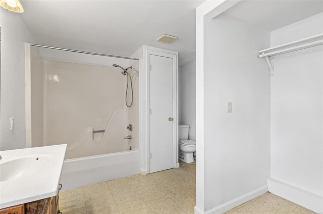 full bathroom featuring vanity, tub / shower combination, and toilet