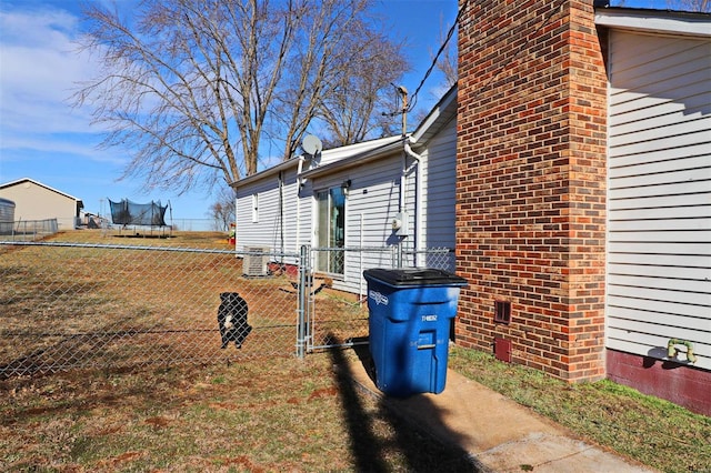 view of property exterior featuring a trampoline