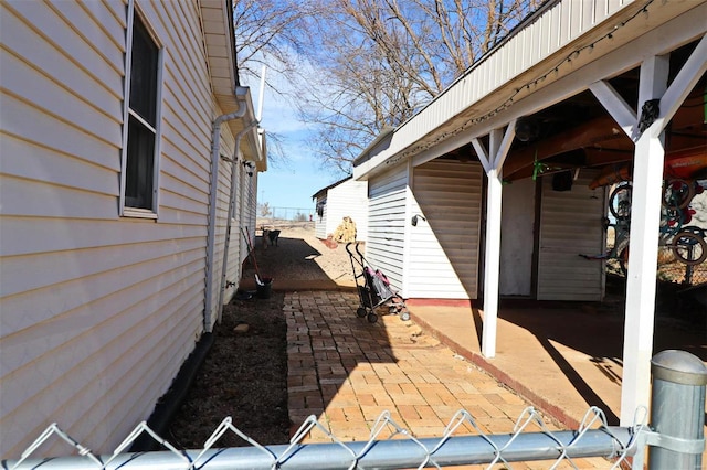 view of property exterior with a patio