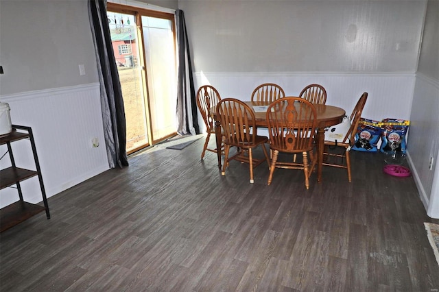 dining space featuring dark wood-type flooring