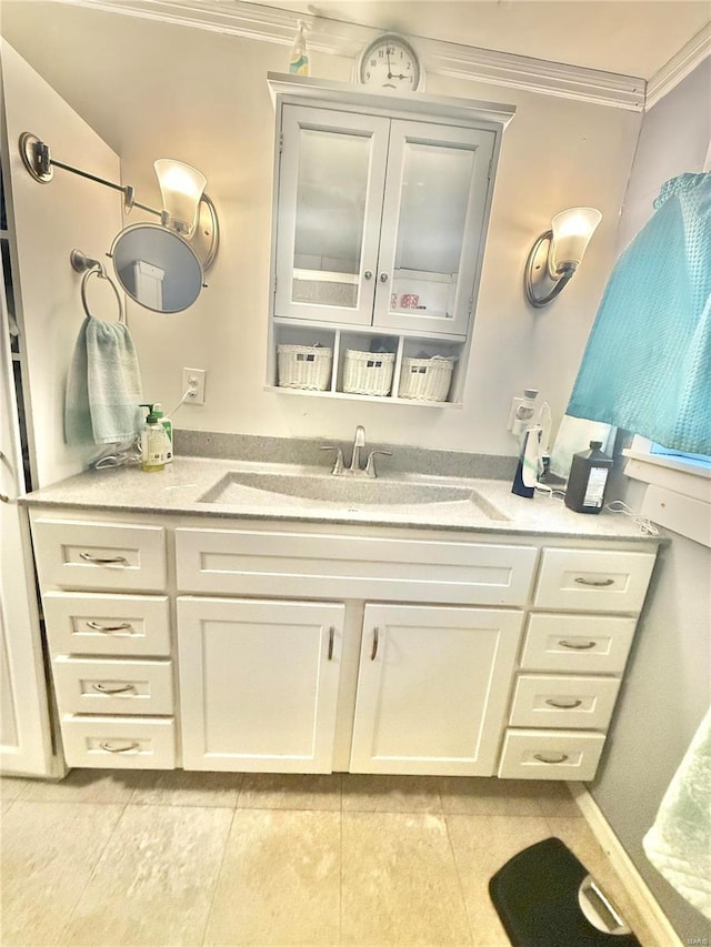 bathroom featuring vanity, tile patterned flooring, and ornamental molding