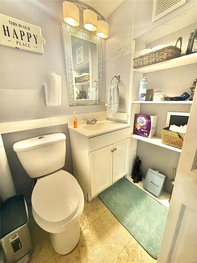 bathroom with vanity and toilet