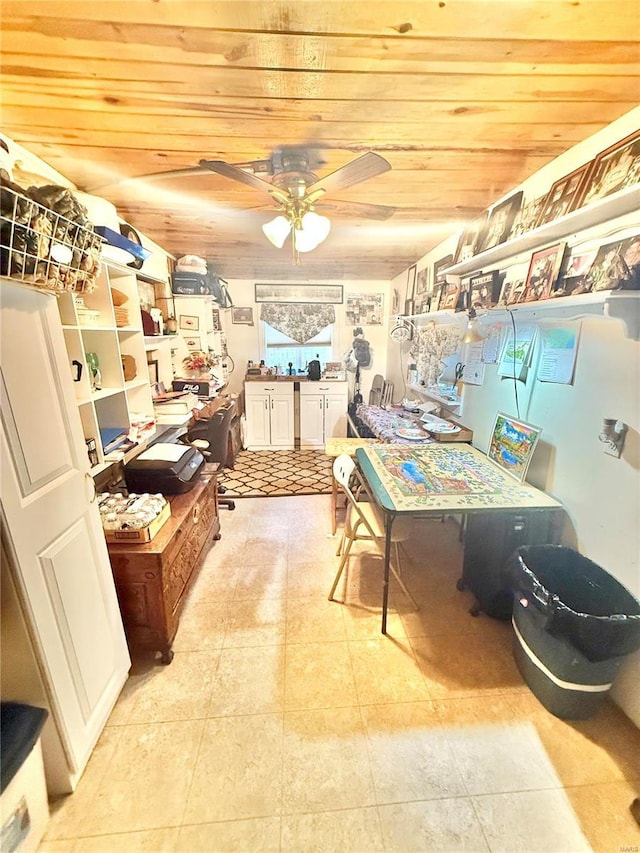 interior space featuring wood ceiling, ceiling fan, and light tile patterned flooring