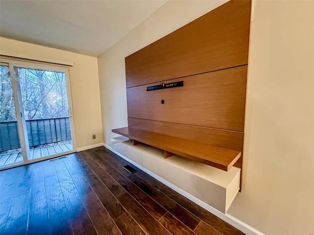 mudroom featuring visible vents, dark wood finished floors, and baseboards