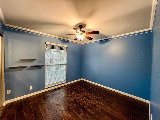 unfurnished room with baseboards, visible vents, a ceiling fan, wood-type flooring, and crown molding