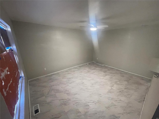 spare room with ceiling fan