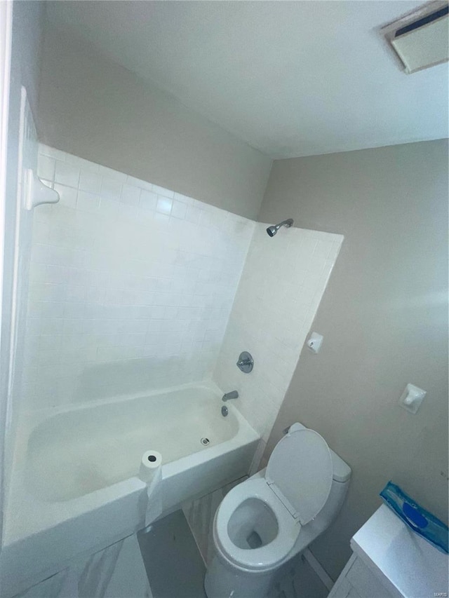 bathroom featuring shower / bathtub combination and toilet