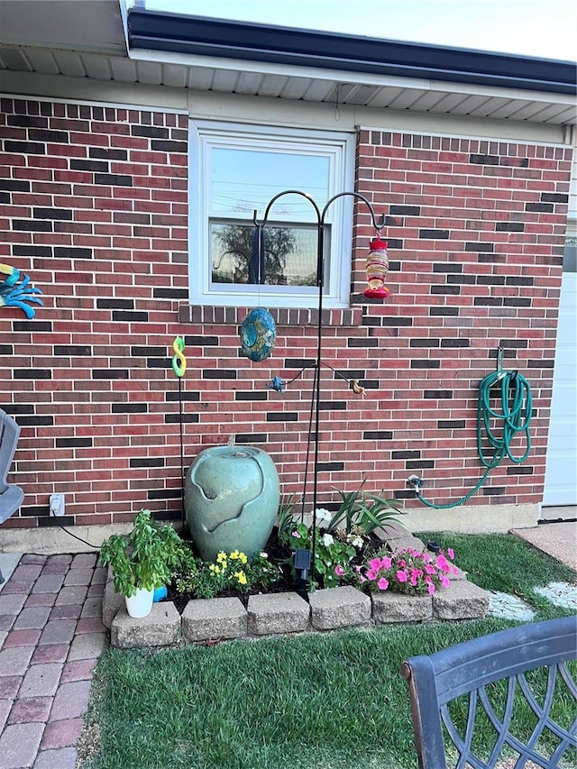 entrance to property with brick siding