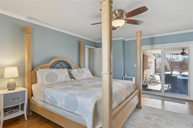 bedroom with ornate columns, access to outside, ornamental molding, and wood finished floors