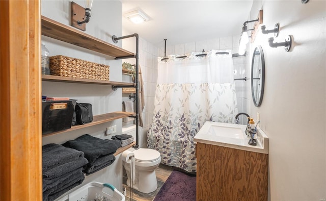 bathroom with vanity, a shower with shower curtain, and toilet