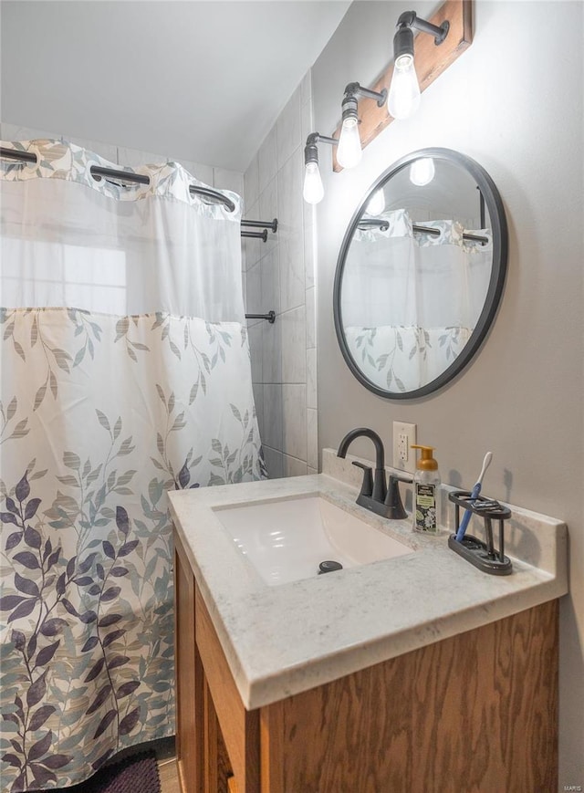 bathroom featuring vanity and walk in shower