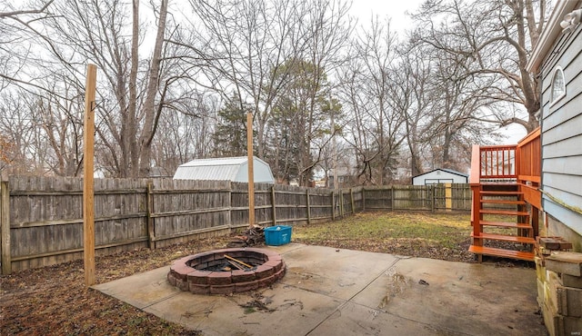 view of patio / terrace featuring an outdoor fire pit