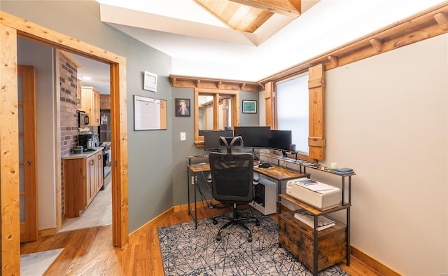 home office with light wood-type flooring