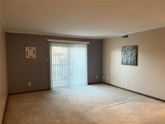 carpeted spare room with crown molding