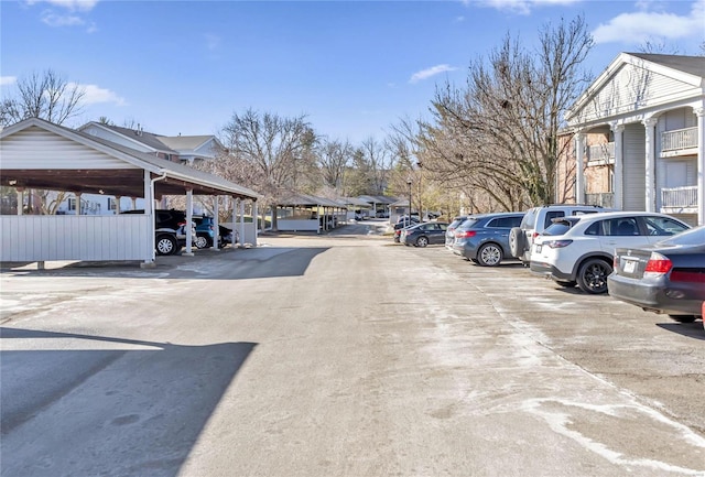 view of partially covered parking lot