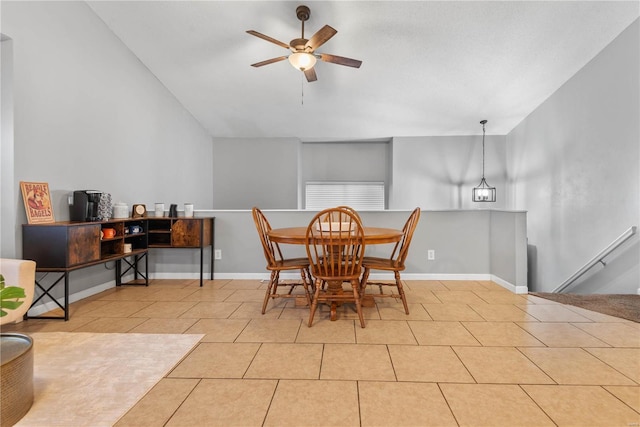 tiled dining space with ceiling fan