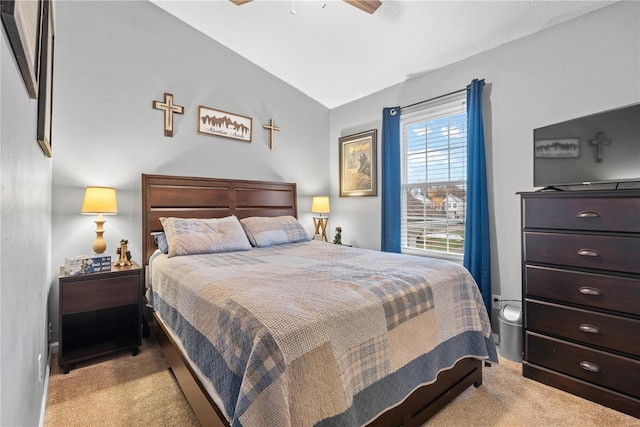 carpeted bedroom with ceiling fan and lofted ceiling