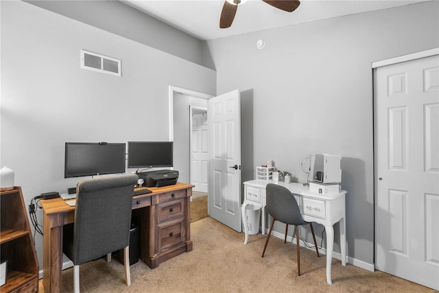 home office featuring ceiling fan, light colored carpet, and vaulted ceiling